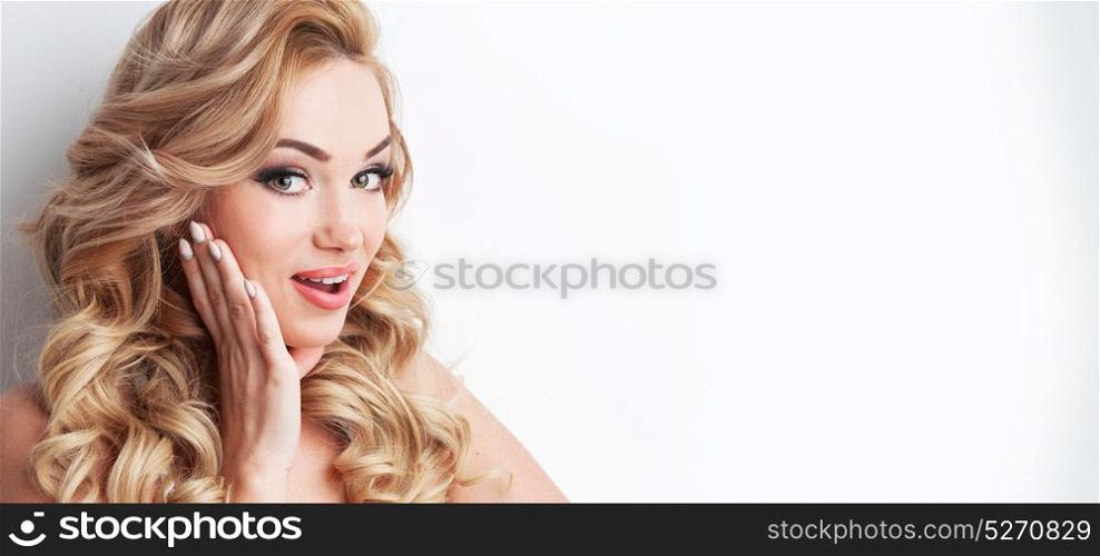 Portrait of surprised girl. Close-up portrait of surprised beautiful girl with hand on face