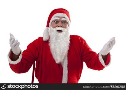 Portrait of surprised Santa Claus gesturing over white background