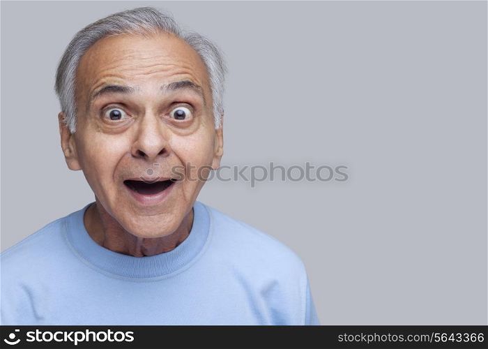 Portrait of surprised senior man