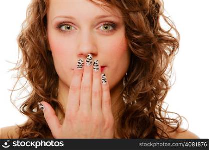 Portrait of surprised shocked woman. Girl covering her mouth with hand creative manicure isolated on white. Studio shot.