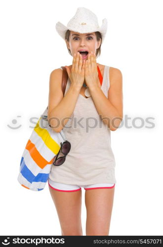 Portrait of surprised young beach woman in hat