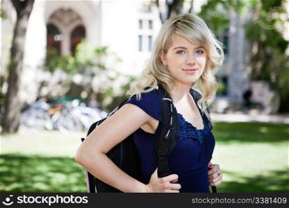 Portrait of sweet college girl with backpack