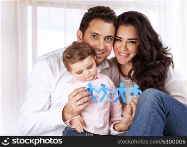 Portrait of sweet little child with mother and father at home, kid safety, people protection, creative education concept