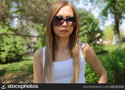 Portrait of sweet young woman enjoying at the park - Outdoor