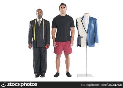 Portrait of tailor standing with customer over white background