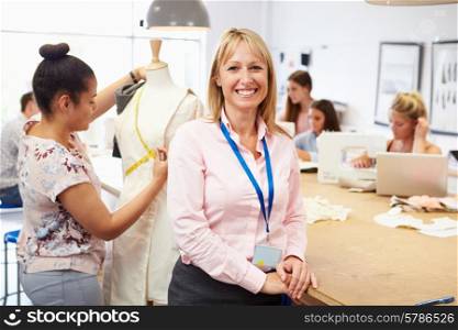 Portrait Of Teacher Helping College Fashion Students