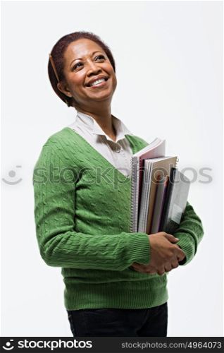 Portrait of teacher holding books