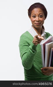 Portrait of teacher holding books