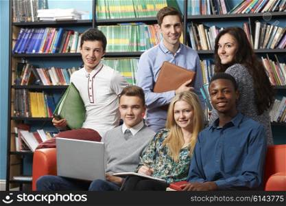 Portrait Of Teacher With Students In Library