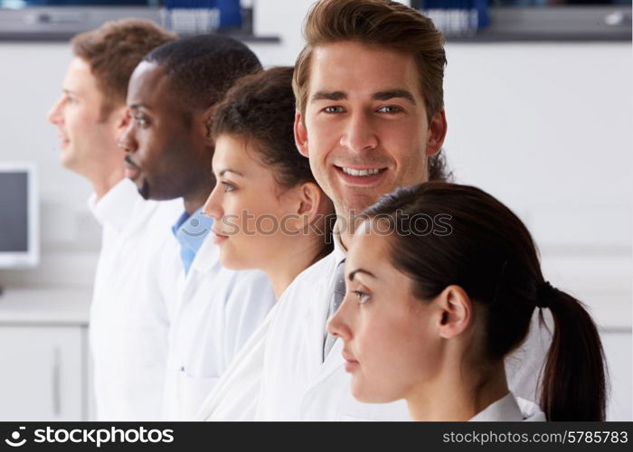 Portrait Of Technician In Laboratory With Colleagues