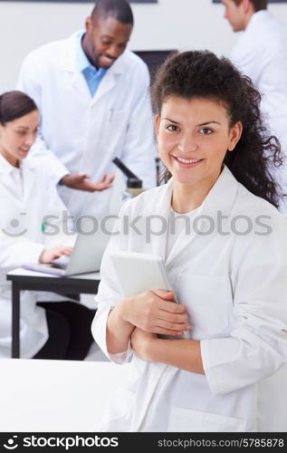 Portrait Of Technician In Laboratory With Colleagues