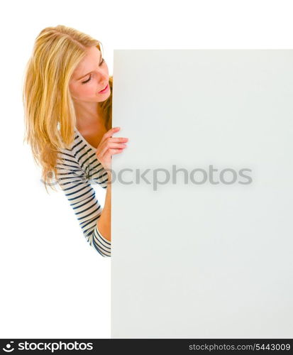 Portrait of teen girl looking on blank billboard&#xA;