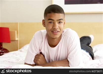 Portrait Of Teenage Boy In Bedroom