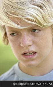 Portrait Of Teenage Boy Looking Angry