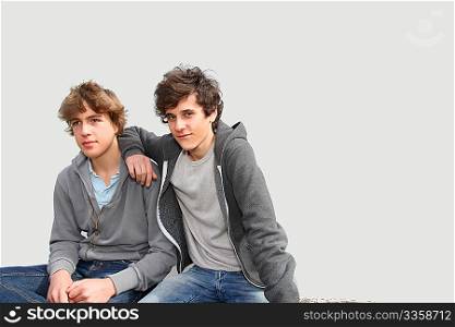 Portrait of teenage boys in front of white background