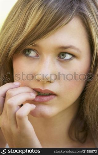 Portrait Of Teenage Girl Biting Nails