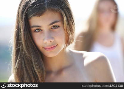 Portrait of teenage girl, focus on foreground