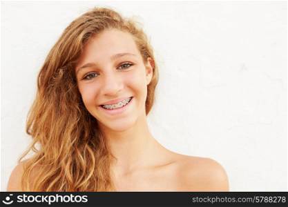 Portrait Of Teenage Girl Leaning Against Wall