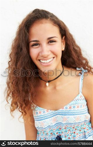 Portrait Of Teenage Girl Leaning Against Wall
