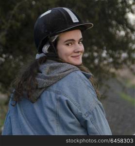 Portrait of teenage girl looking over shoulder and smiling, Galilee, Israel