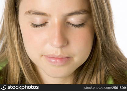 Portrait Of Teenage Girl With Eyes Closed