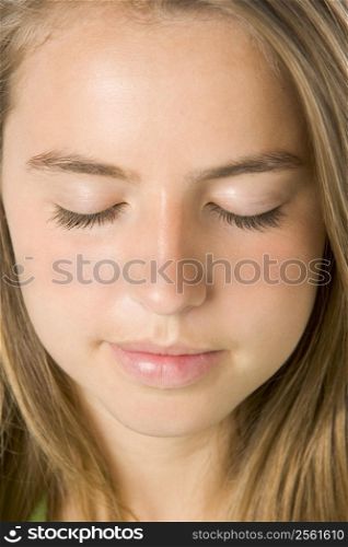 Portrait Of Teenage Girl With Eyes Closed