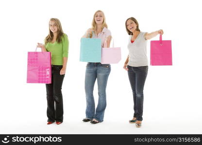 Portrait Of Teenage Girls Holding Shopping Bags