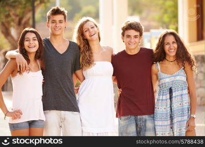 Portrait Of Teenage Group Walking Along Street
