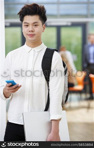 Portrait Of Teenage Male Student In Classroom