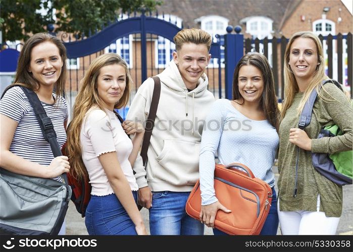 Portrait Of Teenage Students Outside School Building