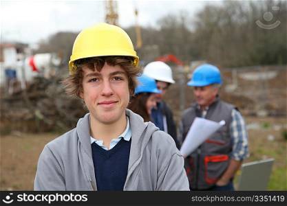 Portrait of teenager with security helmet