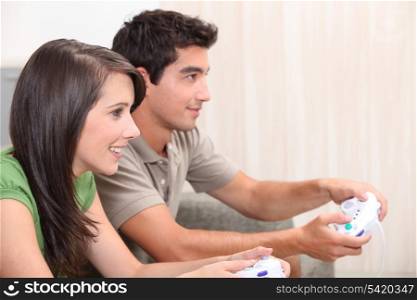 portrait of teenagers playing video game
