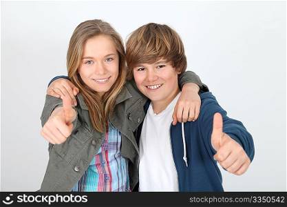 Portrait of teenagers with thumbs up