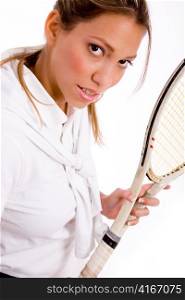 portrait of tennis player looking at camera on an isolated white background