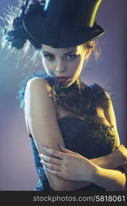 Portrait of the alluring young female model with the black top hat