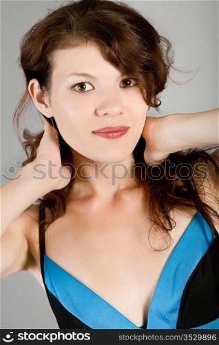 Portrait of the beautiful girl in a dark blue dress