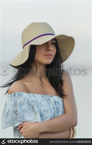 Portrait of the beautiful girl on beach closeup