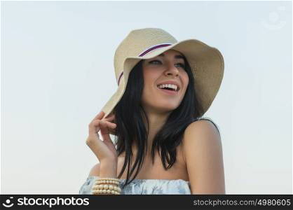 Portrait of the beautiful girl on beach closeup