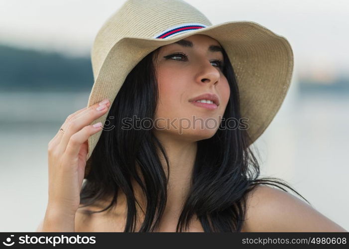 Portrait of the beautiful girl on beach closeup