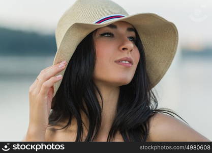 Portrait of the beautiful girl on beach closeup