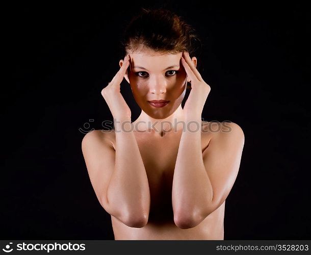 Portrait of the beautiful naked girl on a black background