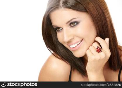 Portrait of the beautiful smiling woman with a ring on a finger, isolated