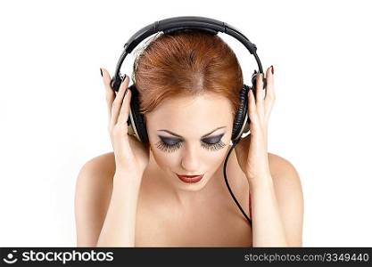 Portrait of the beautiful woman in ear-phones blindly, isolated
