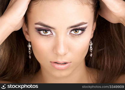 Portrait of the beautiful young woman on a black background