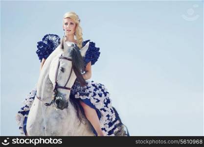 Portrait of the blonde riding the horse