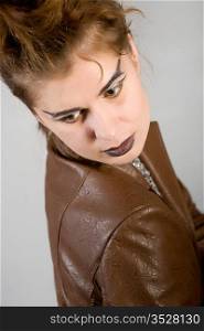 Portrait of the girl in a brown leather jacket