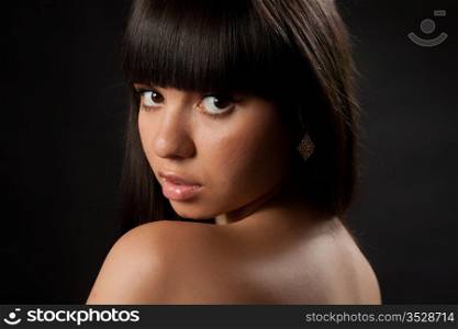Portrait of the girl on a black background