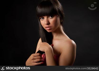 Portrait of the girl on a black background