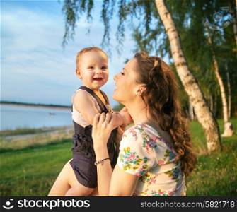 Portrait of the laughing mother and kid