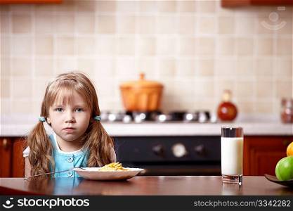 Portrait of the little girl on kitchen